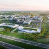 Aerial view of a modern urban development with buildings, green spaces, and roads, evoking growth, sustainability, and community.