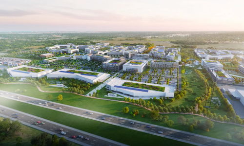 Aerial view of a modern urban development with buildings, green spaces, and roads, evoking growth, sustainability, and community.