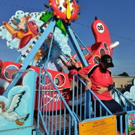 Colorful amusement ride for children with playful designs, evoking excitement and joy; a lively, inviting atmosphere.