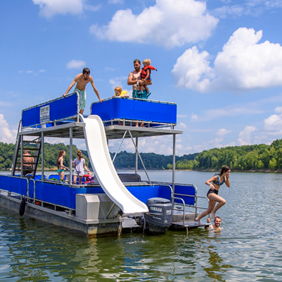 A vibrant summer scene on a lake with a pontoon boat, people playing, swimming, and enjoying fun activities under a sunny sky.
