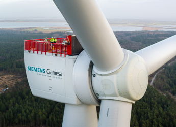 Wind turbine with workers on a service platform; symbolizes innovation, teamwork, and a connection to nature.