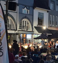 Outdoor concert with the Louisville Orchestra; engaged crowd enjoys live music, creating a festive atmosphere of community.