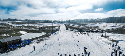Snowy landscape with athletes preparing for winter sports, evoking excitement, serenity, adventure, and community.