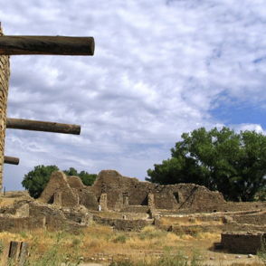 Ancient ruins with crumbling walls and sparse vegetation evoke nostalgia, history, and a serene connection to nature.