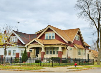 Charming residential neighborhood with cozy homes, inviting roofs, green lawns, and a tranquil, suburban atmosphere.