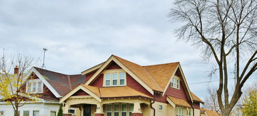 Charming residential neighborhood with cozy homes, inviting roofs, green lawns, and a tranquil, suburban atmosphere.