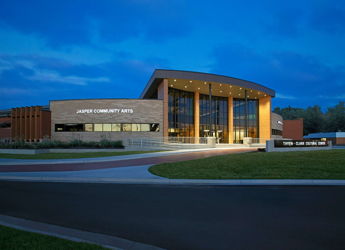 A spacious, modern interior with large windows, polished floors, and inviting furniture, promoting tranquility and community.