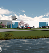 Modern commercial complex by water with a fountain, sleek design, greenery, and a bright sky, evoking tranquility and progress.