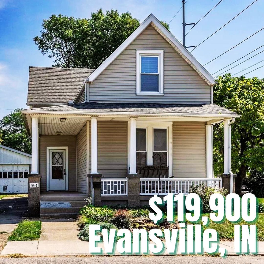 Charming beige house with porch in green yard, priced at $119,900 in Evansville, IN; perfect for first-time buyers.