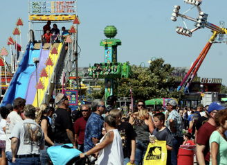 A vibrant fair scene with crowds enjoying rides, laughter, and colorful decorations, evoking joy and nostalgia.