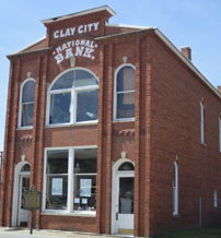 Historic Clay City National Bank, with classic architecture, evokes nostalgia in a quaint, inviting small-town setting.