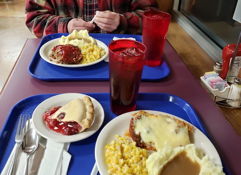 Cozy dining scene with comfort food, inviting atmosphere, and a sense of nostalgia and togetherness.