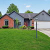 Circular landscaped area with paths, parking, and greenery, fostering tranquility and community in a residential setting.