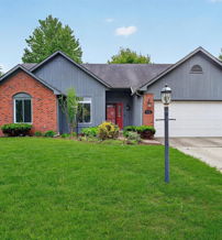 Circular landscaped area with paths, parking, and greenery, fostering tranquility and community in a residential setting.
