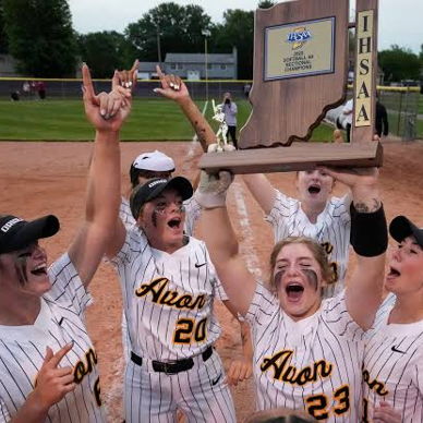 Female athletes celebrate a softball victory, cheering with a trophy, showcasing joy, teamwork, and achievement.