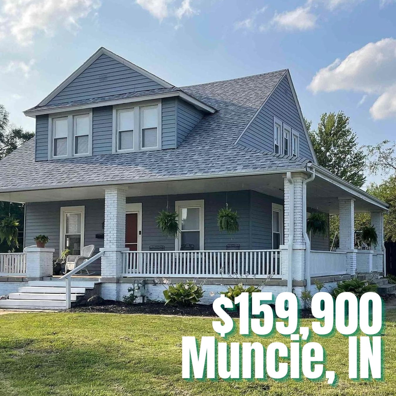 Charming two-story light blue house in Muncie, IN, with a welcoming porch, priced at $159,900; evokes warmth and nostalgia.