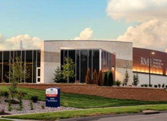 Modern building with glass windows and inviting landscaping, exuding professionalism, trust, and community focus.