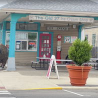 Charming ice cream shop "The Old 27" with colorful turquoise and pink exterior, evoking nostalgia and joy.