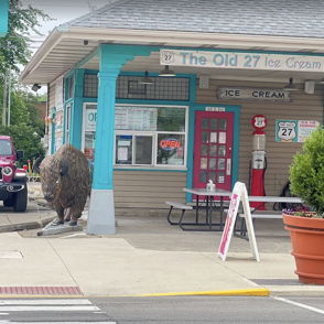 Charming ice cream shop "The Old 27" with colorful turquoise and pink exterior, evoking nostalgia and joy.