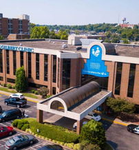 Modern medical clinic with large windows, clear signage, and a welcoming entrance, promoting care, trust, and community wellness.
