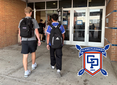 Two students in athletic wear walk towards a school entrance, evoking excitement and nostalgia for school days.