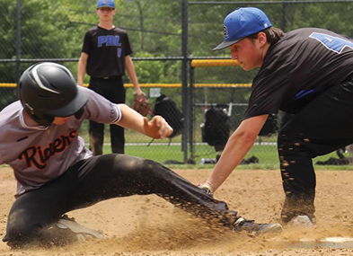 A baseball player slides into a base while being tagged, capturing the excitement and tension of the game amidst cheering fans.
