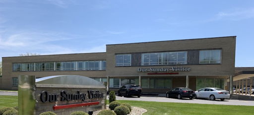 Modern building "Our Sunny Vista" surrounded by greenery, conveying warmth, tranquility, and a welcoming atmosphere.